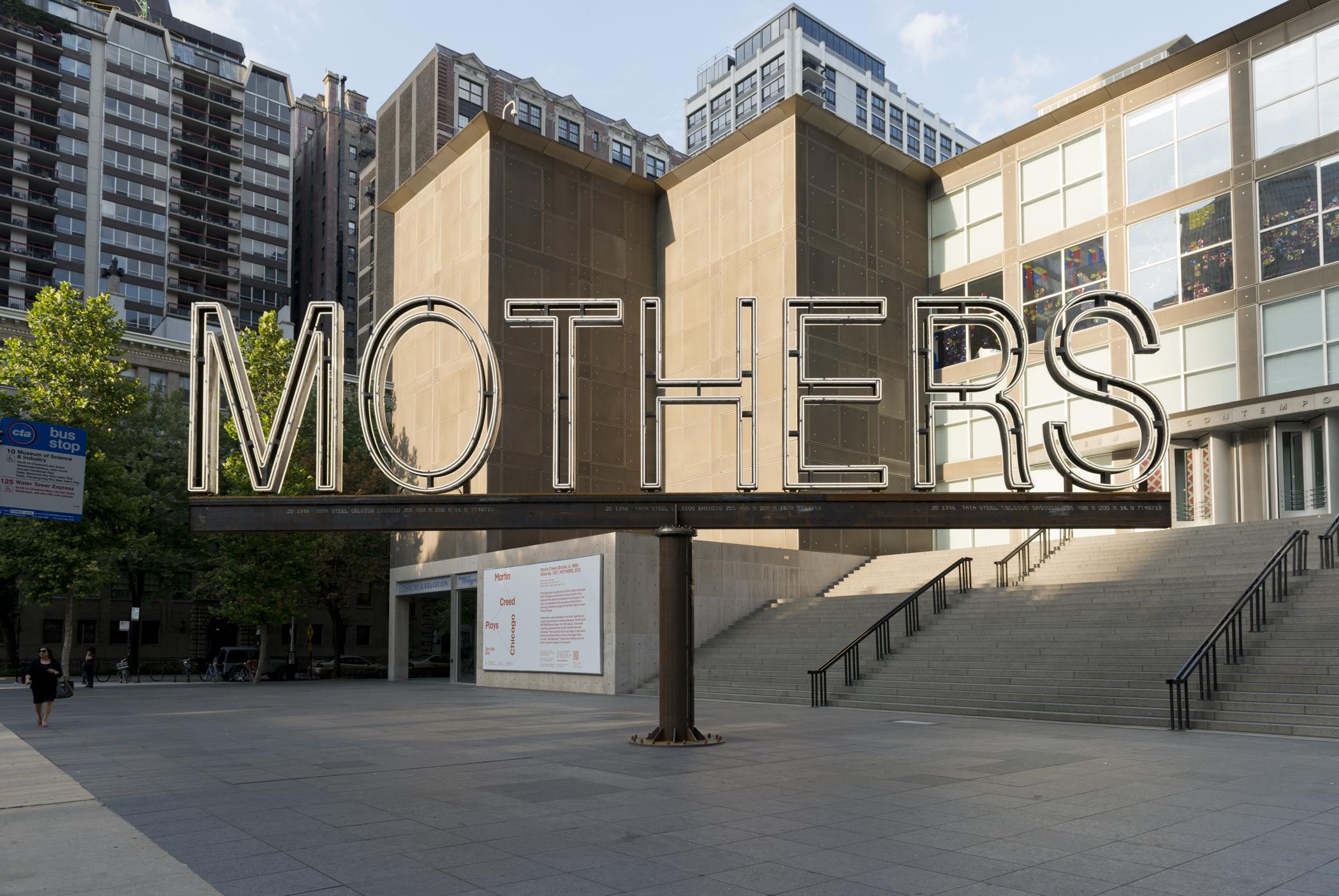 A white neon and steel sign says "MOTHERS."