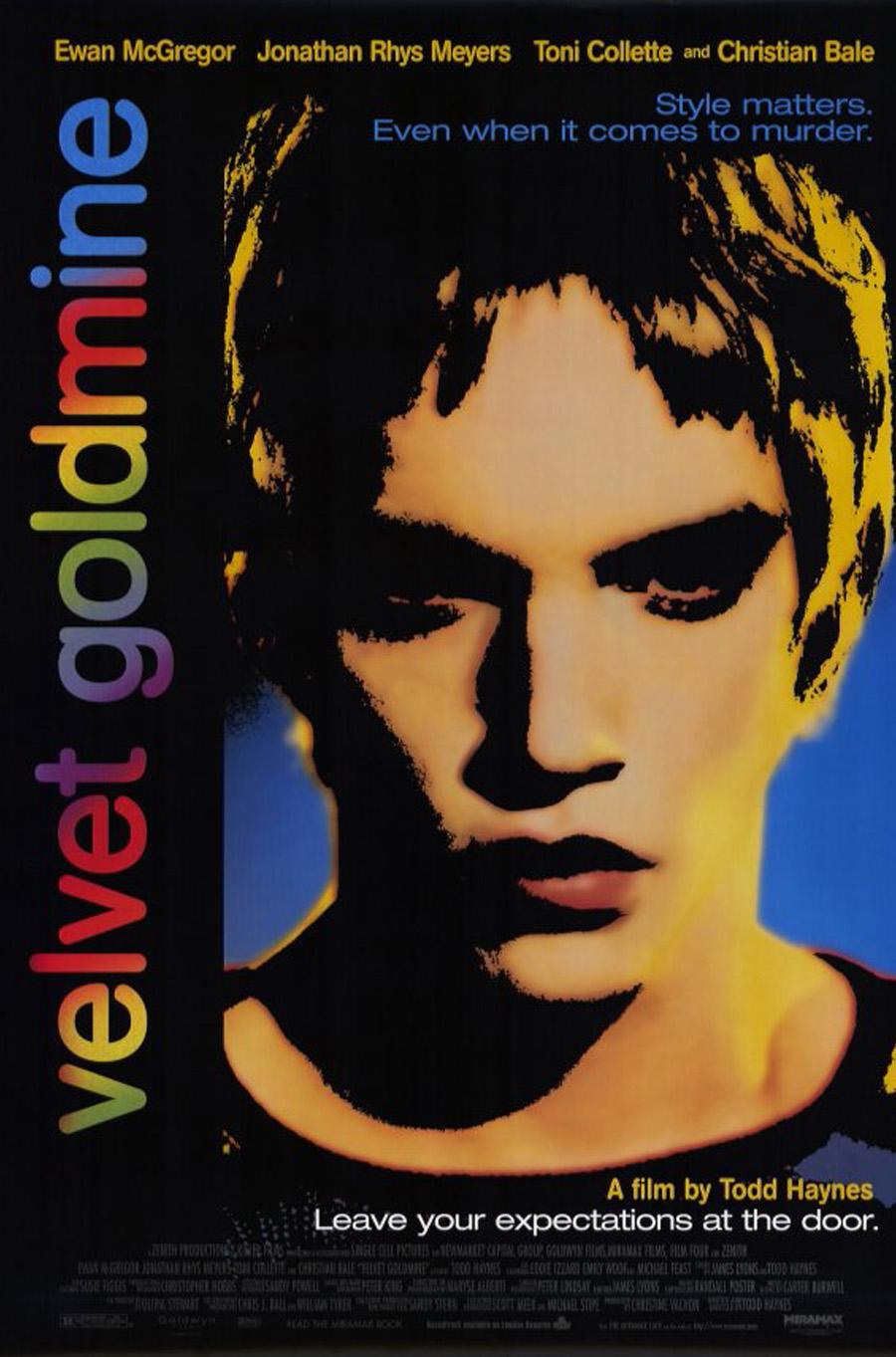 A graphic poster for a movie starring Ewan McGregor, the portrait of a man in highly saturated colors and jet black shadows with "velvet goldmine" in rainbow colors