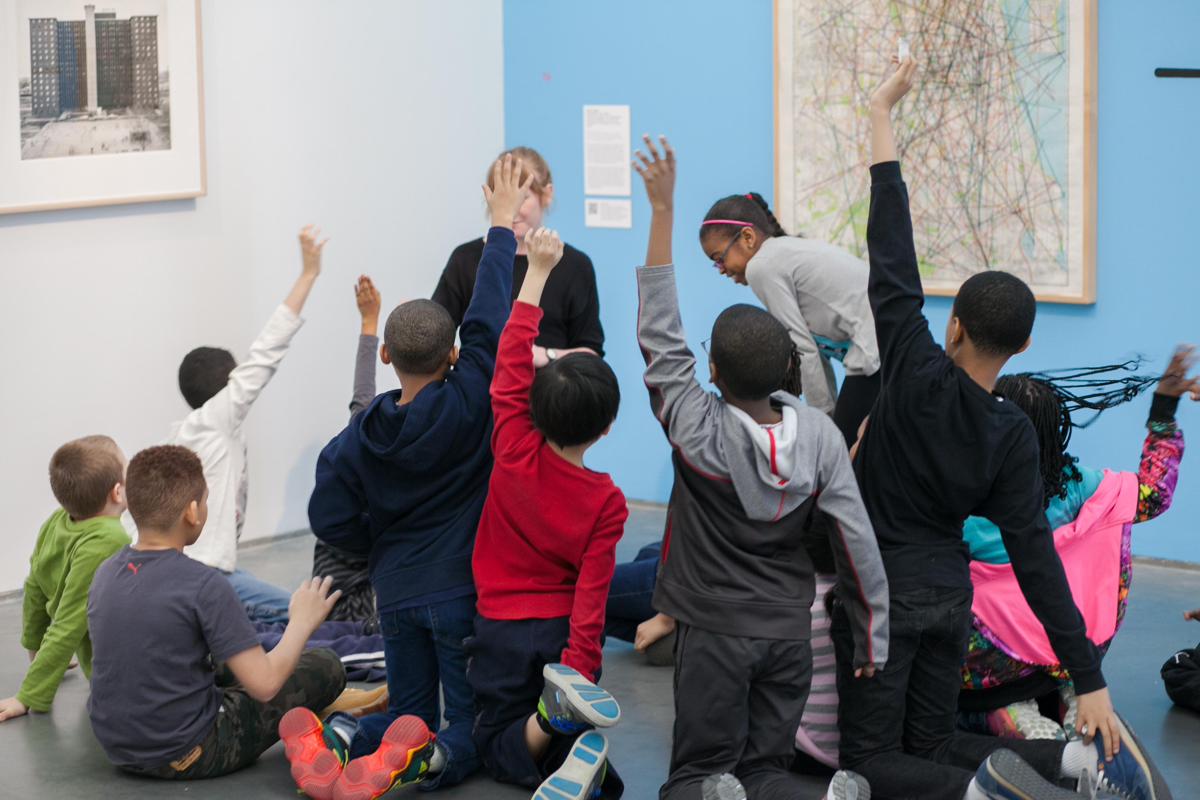 Children and artist guide in MCA gallery with art