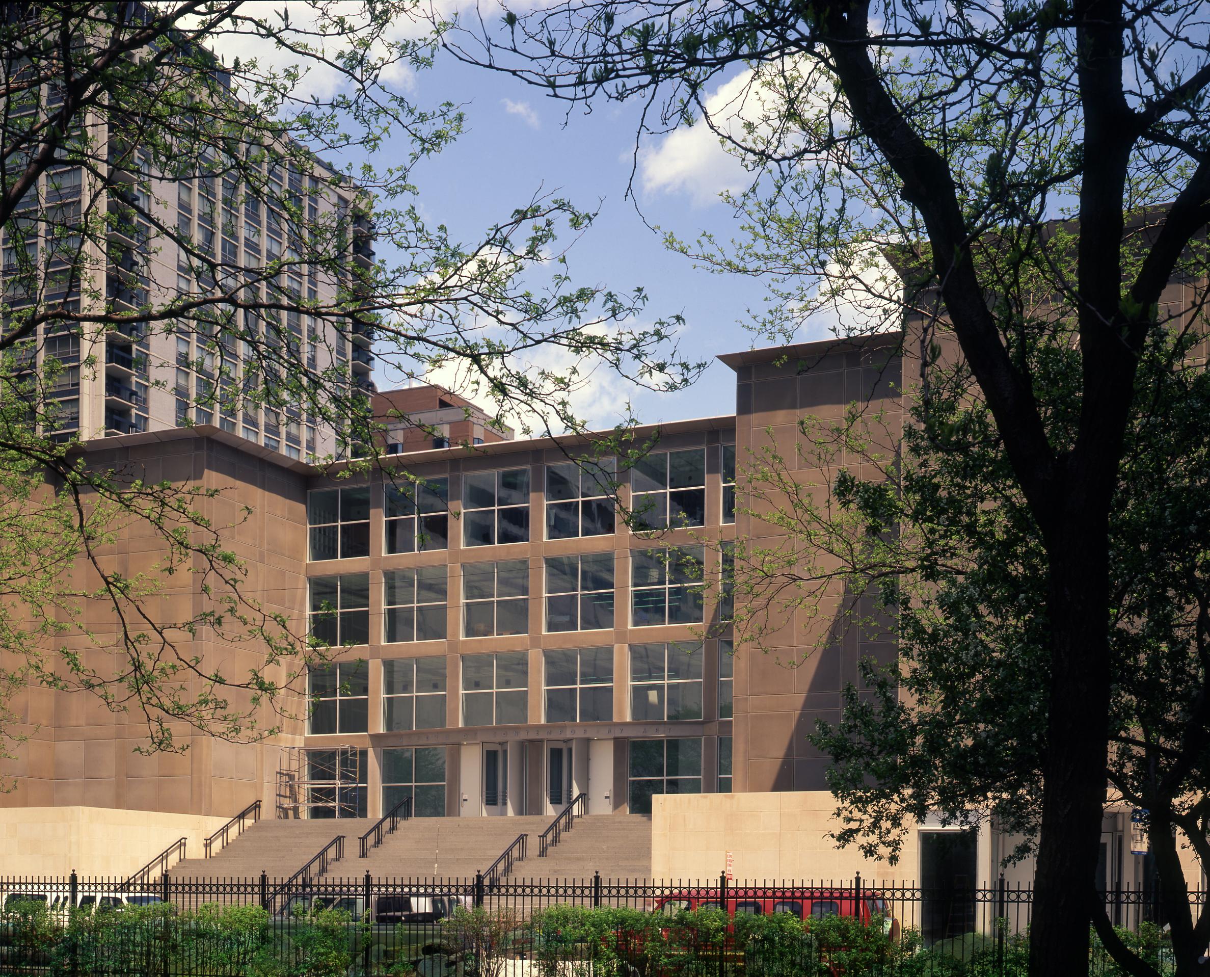 view of the MCA entrance on a sunny day from Seneca Park across the street