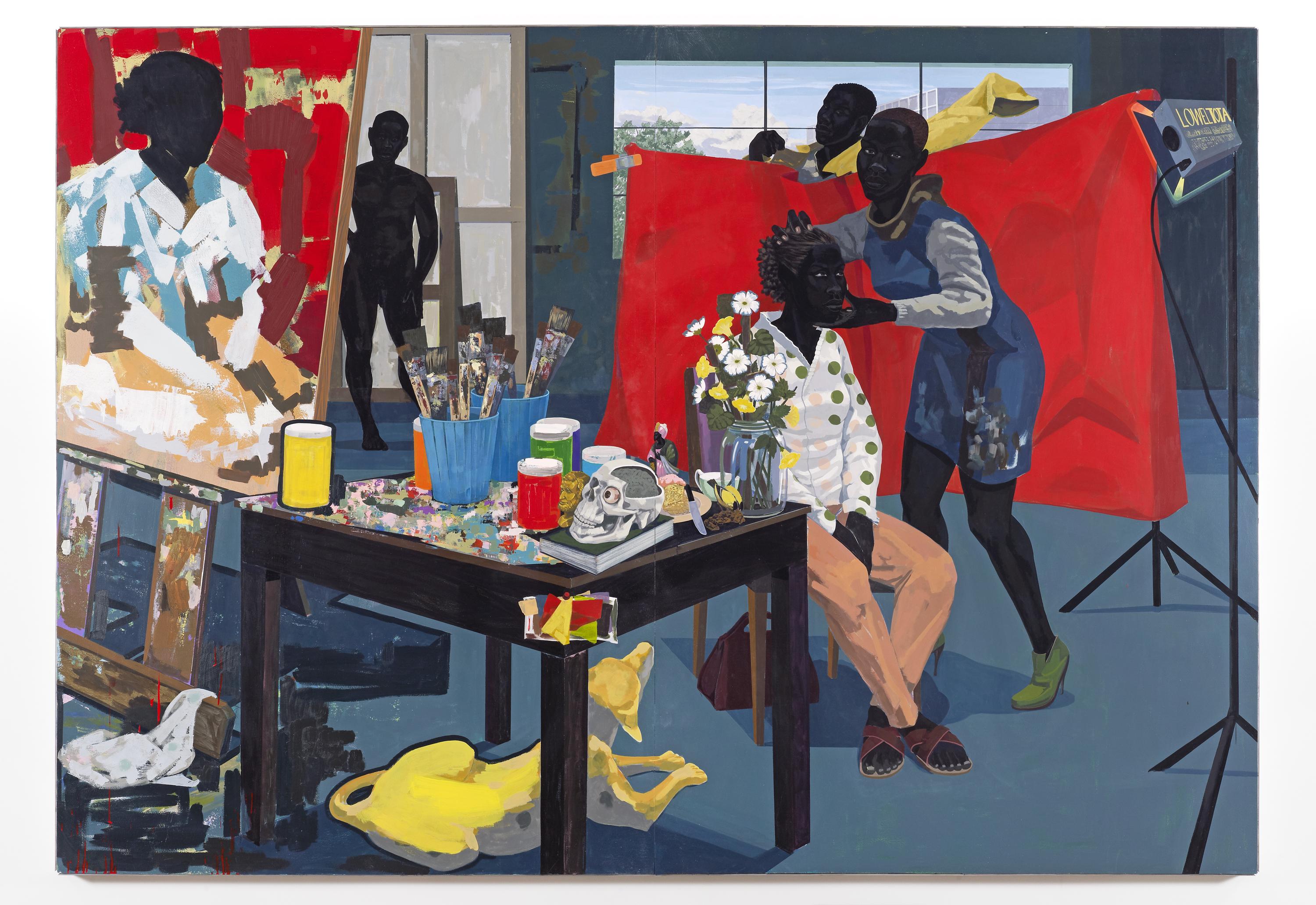 A black woman poses in a chair against a vivid red backdrop while a woman adjusts her head and a man gets dressed behind the backdrop. The painted portrait in progress is shown on an easel at left, next to a table strewn with paints and paintbrushes, a skull, and vase with flowers. A yellow dog rests on the floor below the table. A nude figure stands in the background.