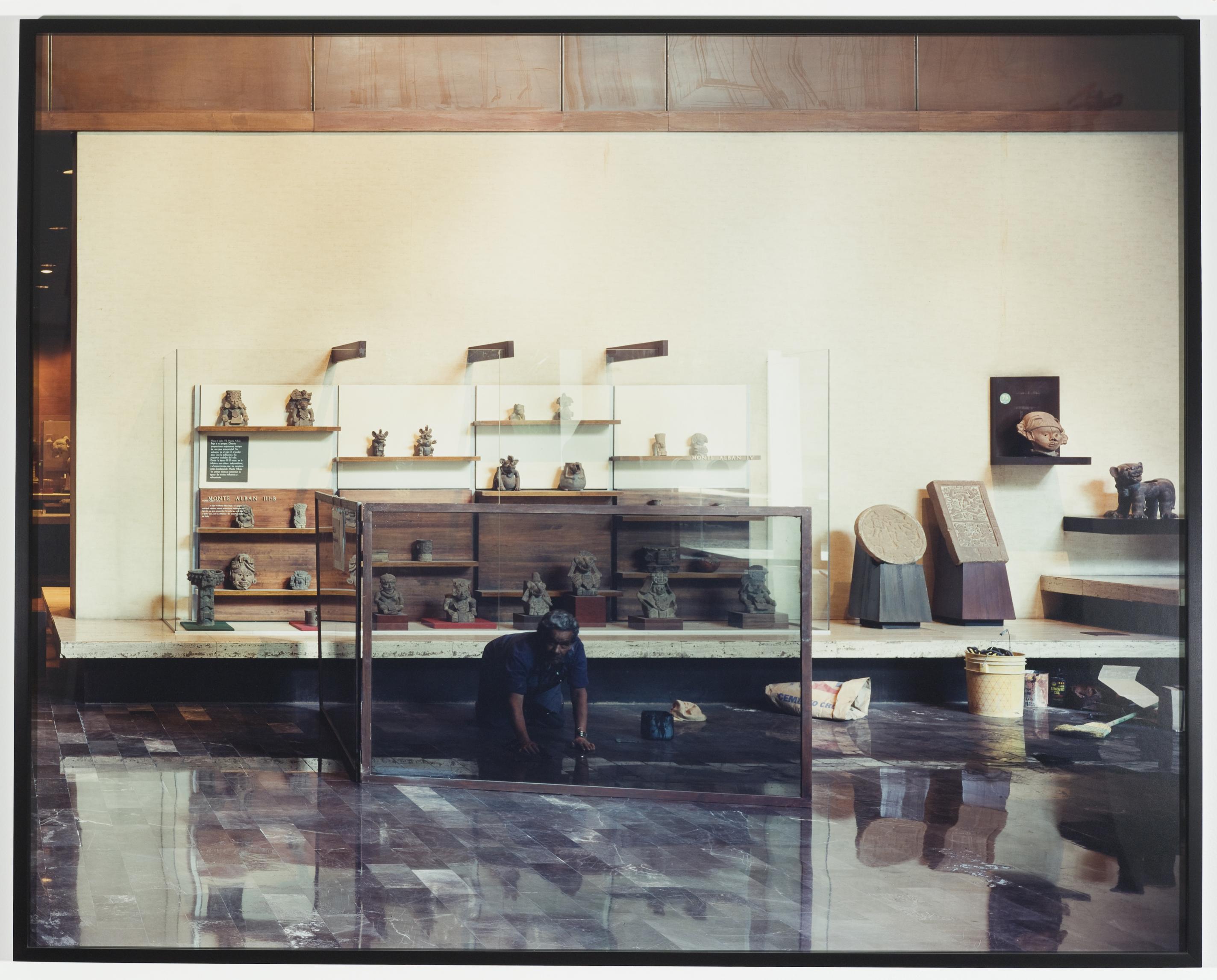 A worker nearing completions as he installs marble tiles