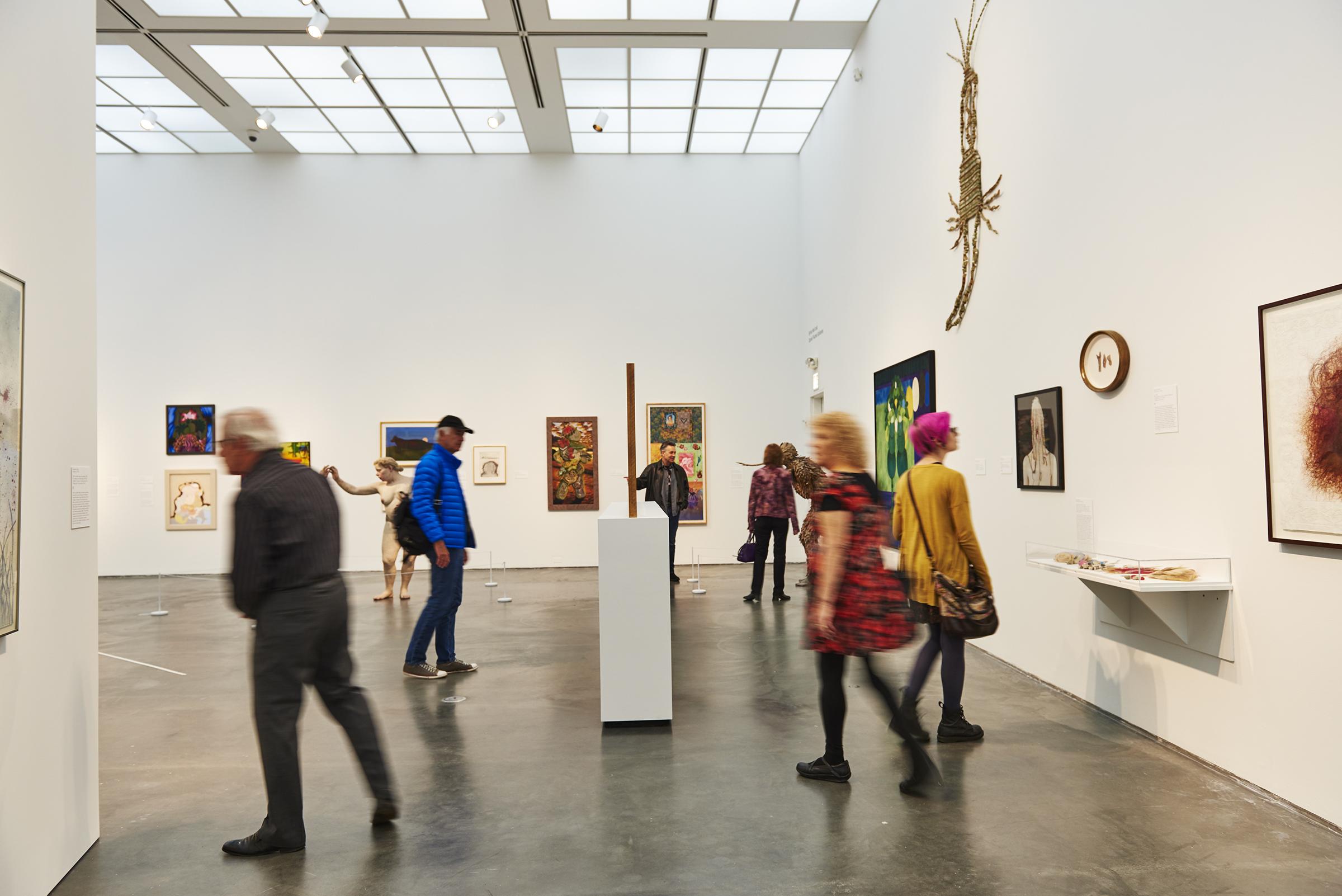 Visitors take in art in a gallery on the MCA's second floor.