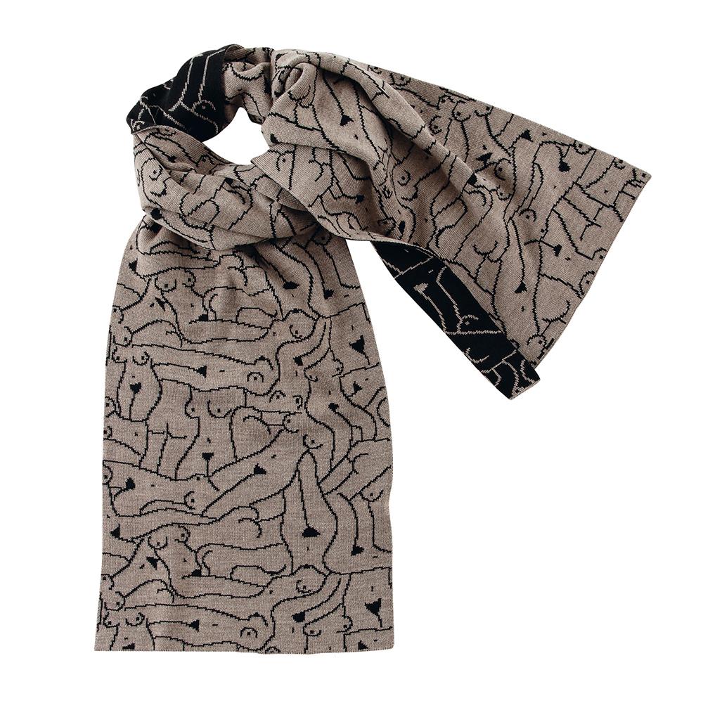 A knit scarf has an all-over design of the outlines of nude women's bodies in black lines on a beige background on one side, and beige outlines on a black background on the other. The scarf is tied in a loose knot.