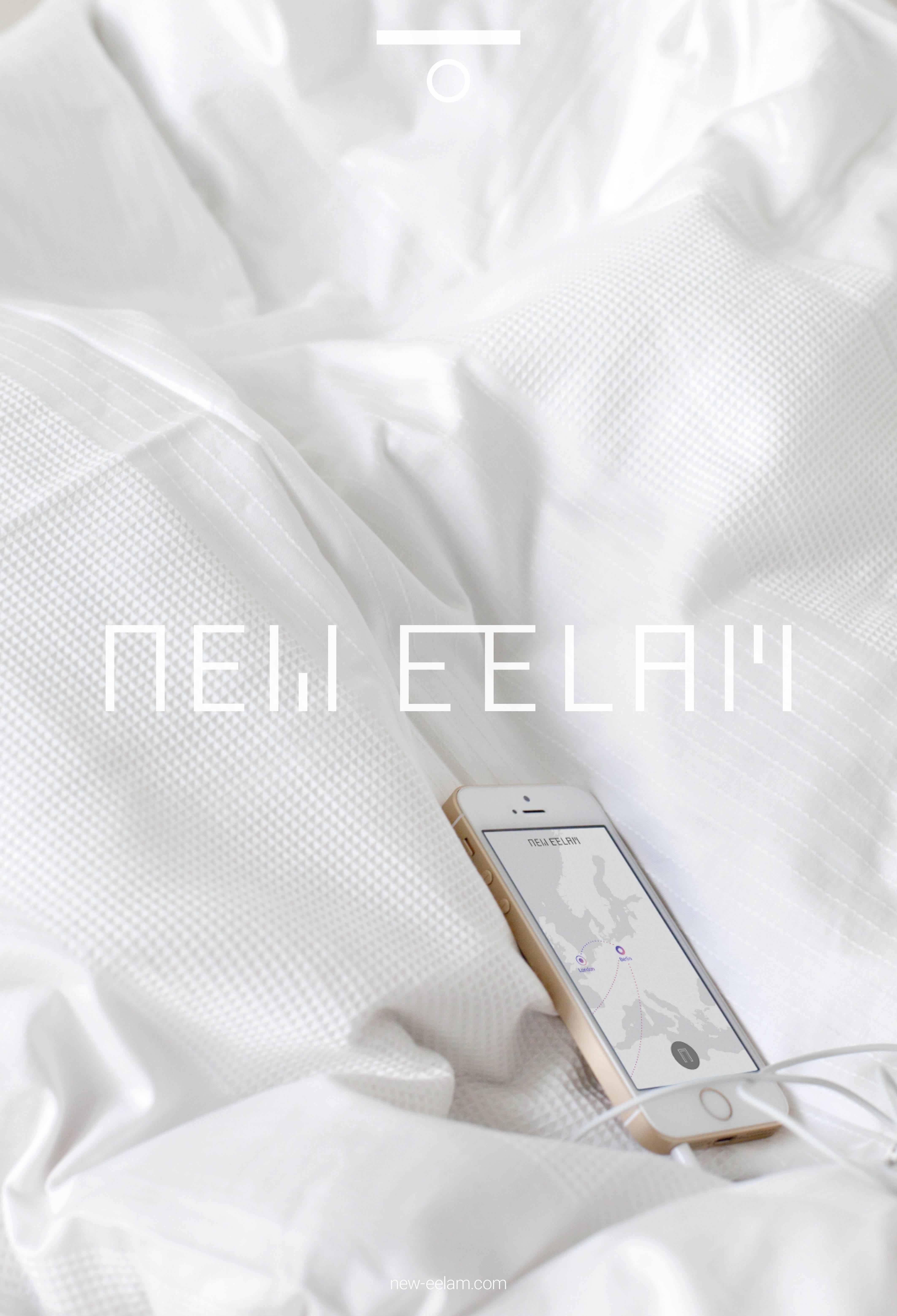 An iPhone displaying an unmarked map of Europe rests on crisp white bedding. Futuristic white text reading "NEW EELAM" appears over the middle of the image.