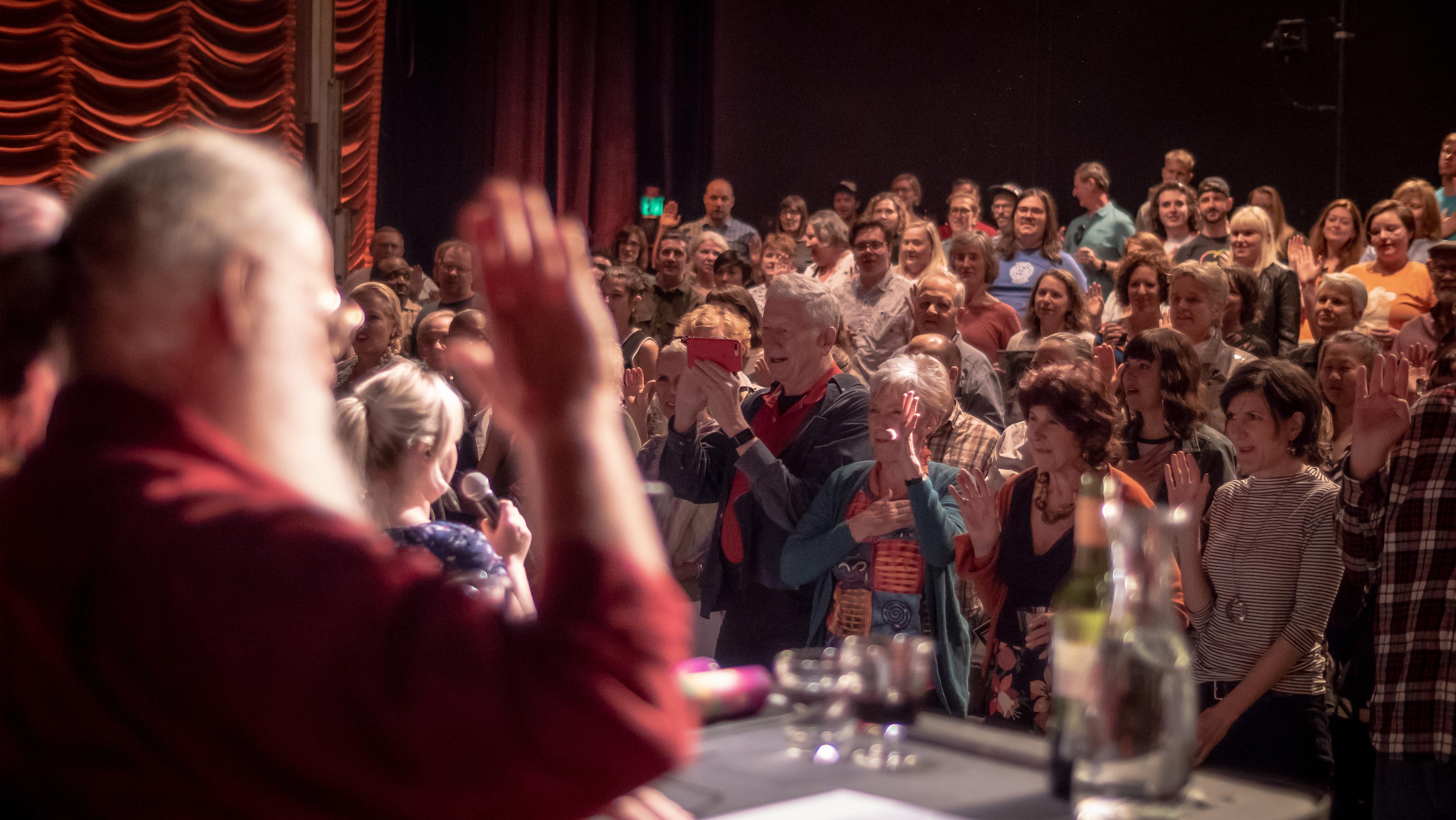 An audience watches a performance