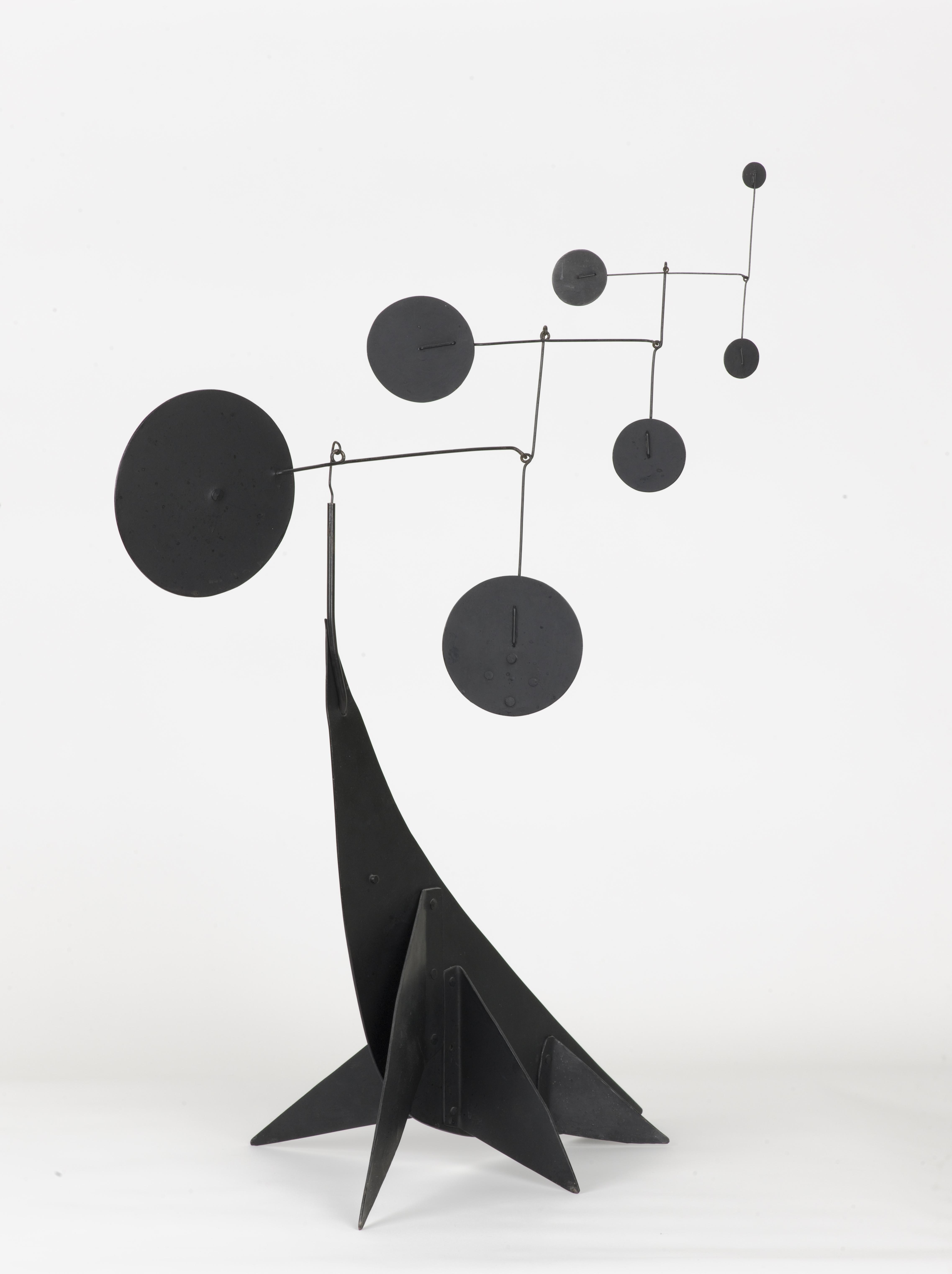 abstract sculpture of seal delicately balancing elements