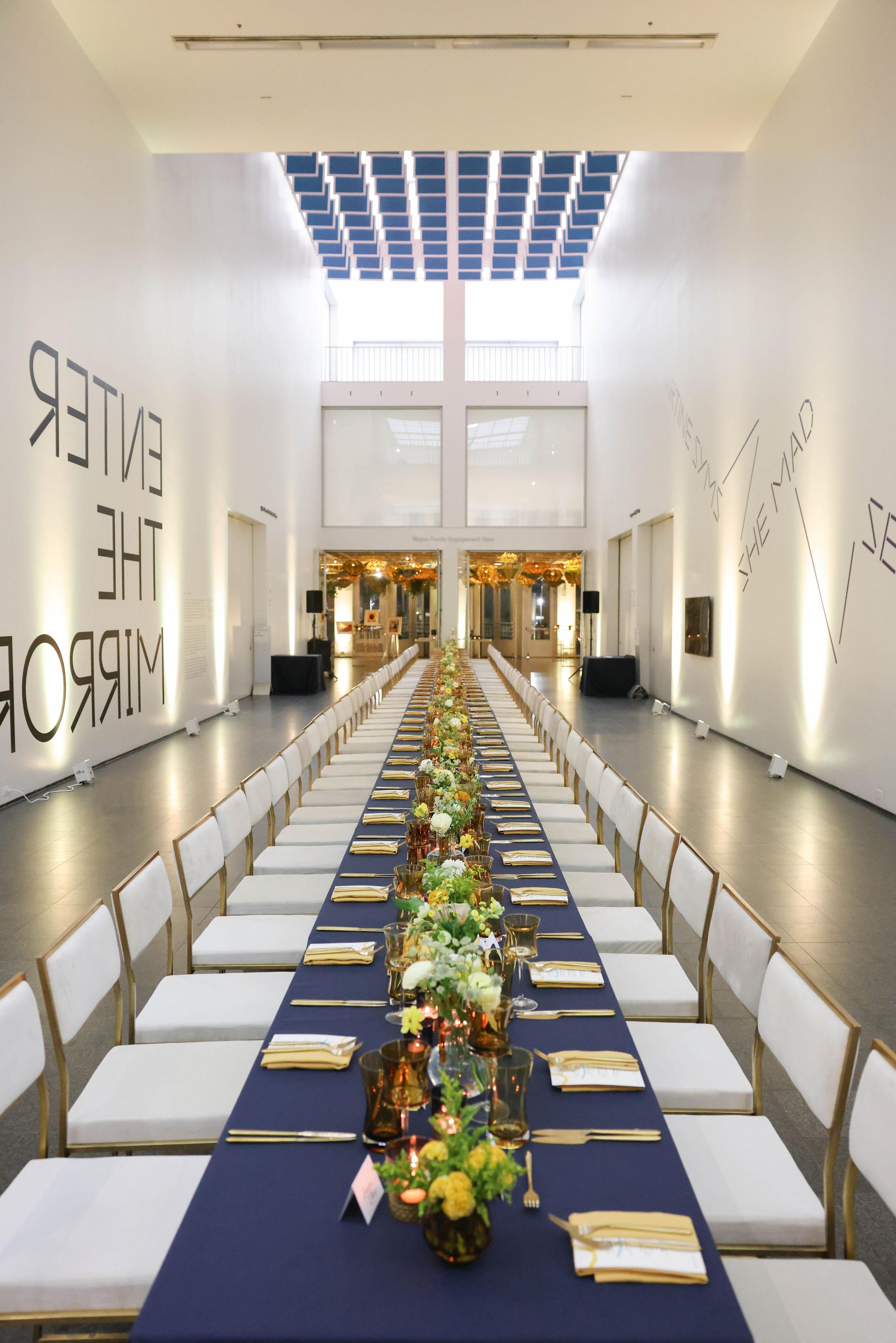 Long table neatly set for an event