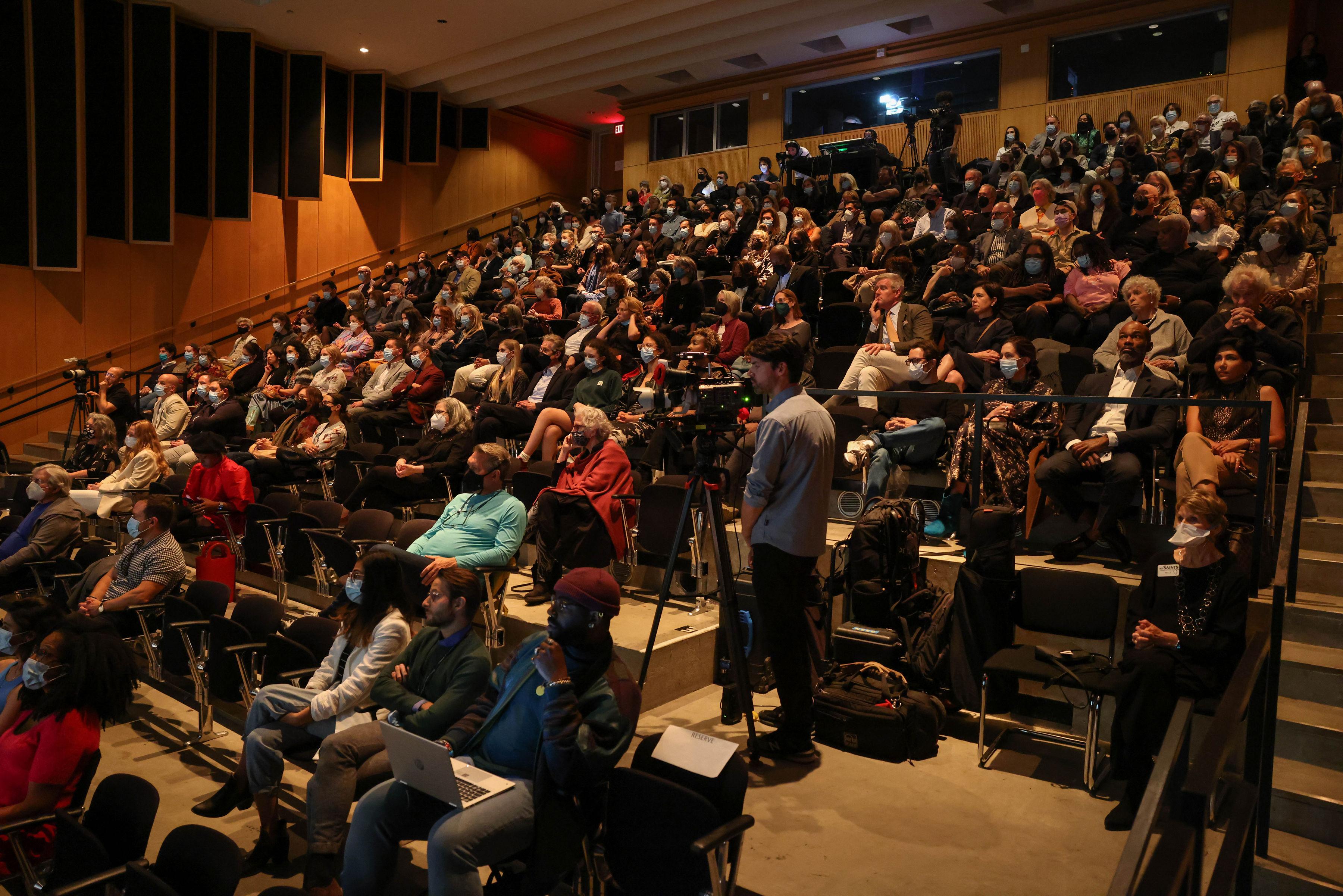 view of audience seated in theater for an event